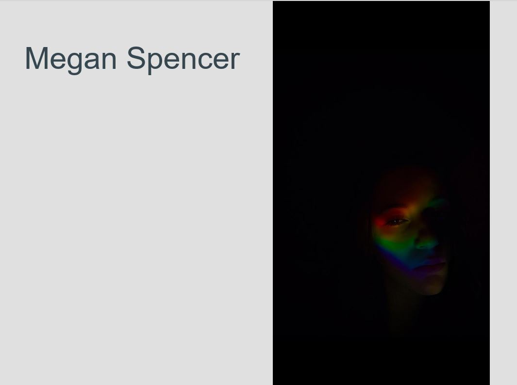 dark image with a soft face and rainbow colors